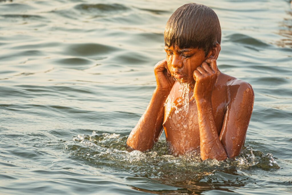 Boy vanaras Holy Bath River India Sorry Sunlight